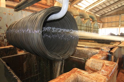 Large spools of Steel Coils being moved.