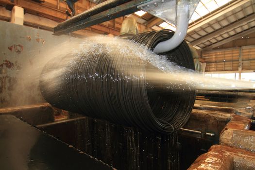 Large spools of Steel Coils being moved.