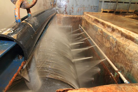 Large spools of Steel Coils being moved.
