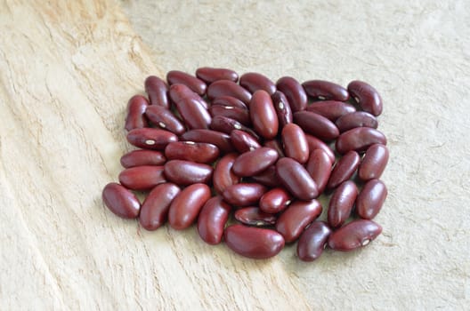 Red beans on wood