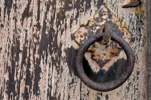 Old door with decay rusty gate latch