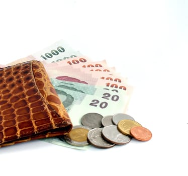Money in leather purse isolated on white background
