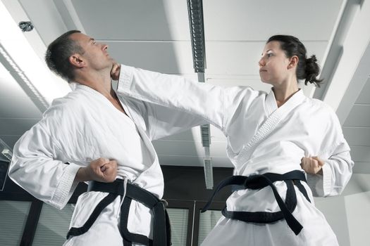 An image of a woman and a man fighting