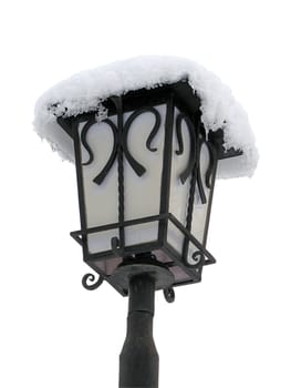 street lamp covered with snow over white