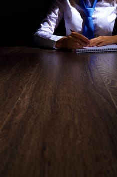 Business woman at office sitting at table and working