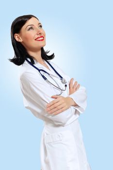 Portrait of happy successful young female doctor holding a stethoscope