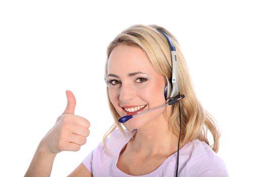 Happy young operator at a call centre or receptionist wearing a headset giving a thumbs up gesture of approval indicating that all is well isolated on white Happy young operator at a call centre or receptionist wearing headphones giving a thumbs up gesture of approval indicating that all is well isolated on white