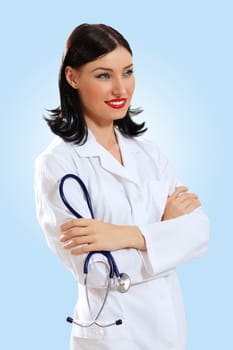 Portrait of happy successful young female doctor holding a stethoscope