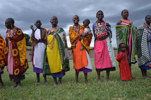 Masai Mara,Kenya, October 17, 2011:Masai women with traditional clothes in a small villages in the Masai Mara