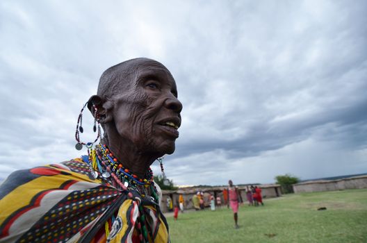 Village Masai Mara,Kenya, October 17, 2011: Portrait of Masai elderly woman. The Masai are a Nilotic ethnic group of semi-nomadic people located in Kenya and northern Tanzania.