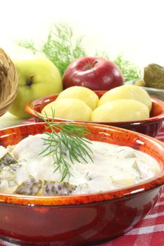 marinated Cream herring with jacket potatoes and fresh dill