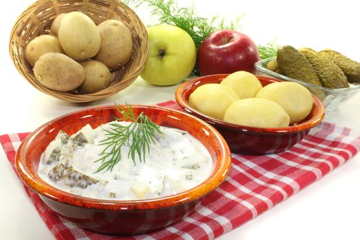 marinated Cream herring with jacket potatoes, pickled cucumber and fresh dill