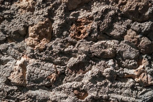 Surface of Textured stonework background. Brown tint