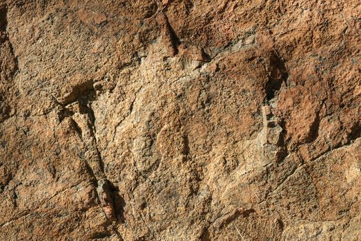 Surface of Textured stone background. Yellow tint