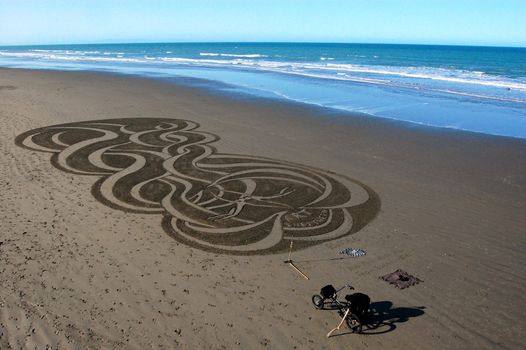 Sand art on New Brighton beach, Christchurch, New Zealand