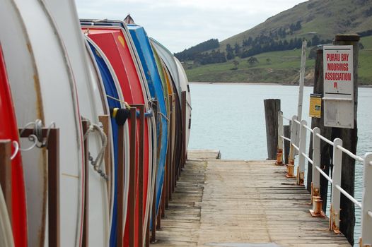 Boats at timber pier, Banks Peninsula, New Zealand