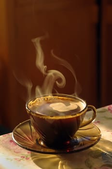 warm cup of coffee with smoke