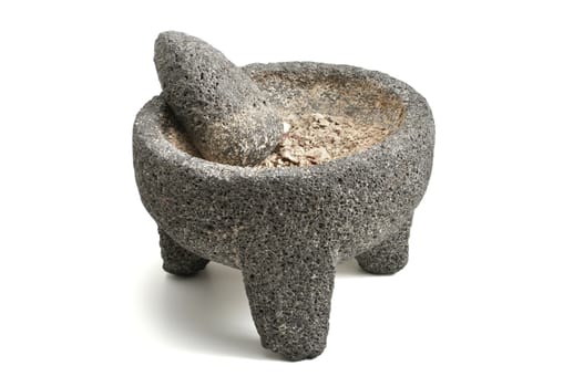 Stone mortar and pestle with ground potato on white background