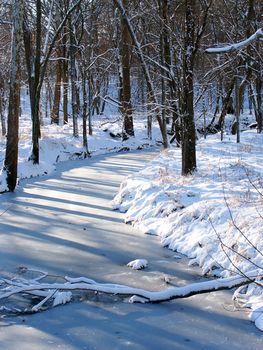 Shadows cast over a frozen creek in the Midwest United States.