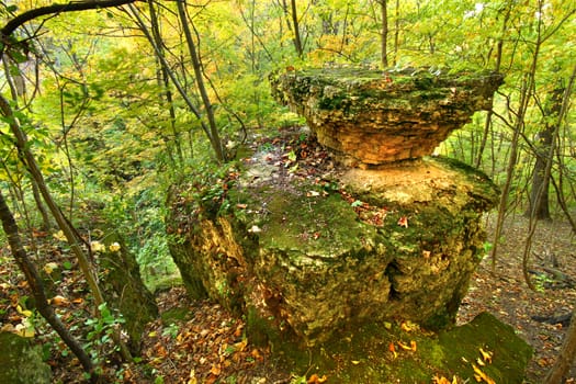 Autumn scenery surrounds an interesting rock formation in Illinois.