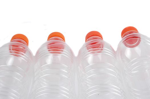 four closed plastic bottles isolated on white background