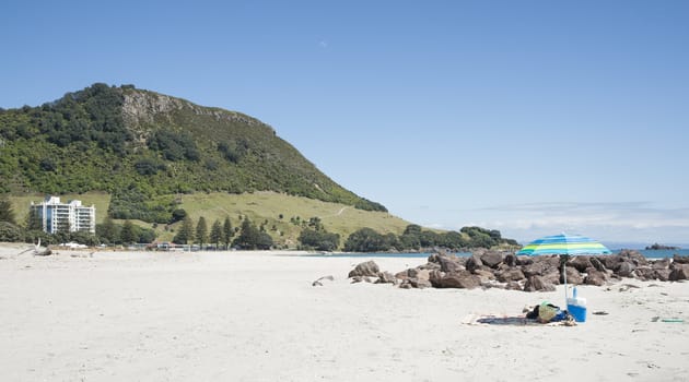 White sandy beach with Mount Maunganui