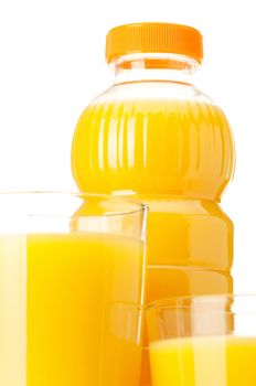 Orange juice in plastic bottle and glass on white background