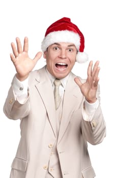 Portrait of handsome man in santa hat on white background