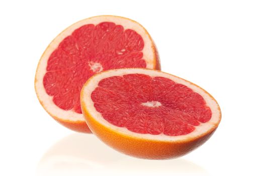 Fresh ripe half grapefruit on white background