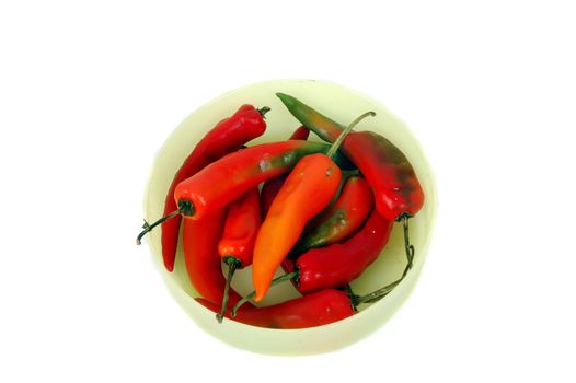 a bowl of fresh red chili isolated on white background