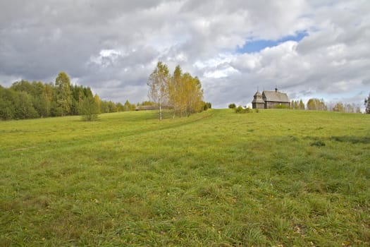 Autumn rural landscape with a church in the background