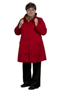 Middle-aged woman in a red cape on a white background