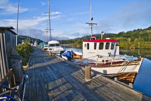 sjark boat is a type of light fishing and shuttle boat with room for a single fisherman and is common along the coast of norway, but it is mostly coastal fishermen with sjark in northern norway, the boat is moored to the pier in tista river in halden.