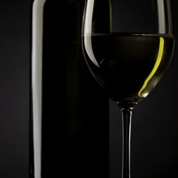 white wine glass silhouette black background