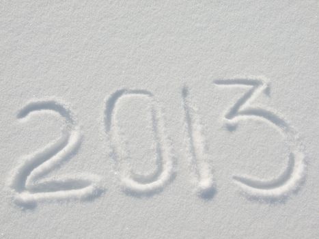 Message handwritten in fresh powdery natural snow for 2013