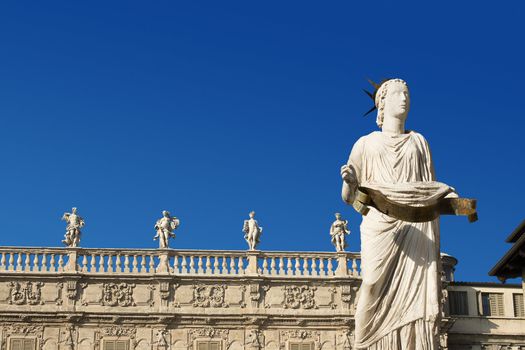Detail of the fountain of Madonna Verona and Palazzo Maffei - Verona Italy