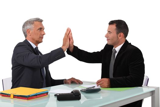 business partners sitting at table