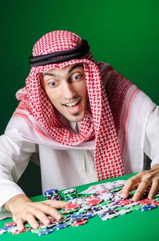 Arab playing in casino - gambling concept with man