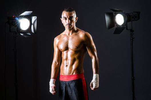 Boxer with studio lights in sports concept