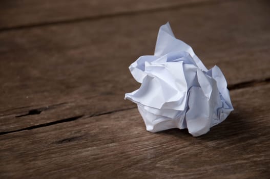 Crumpled paper ball on the table.