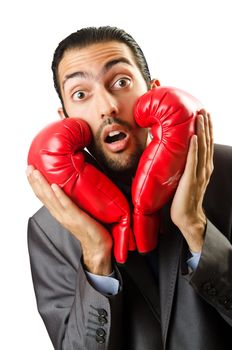 Businessman with boxing gloves on white