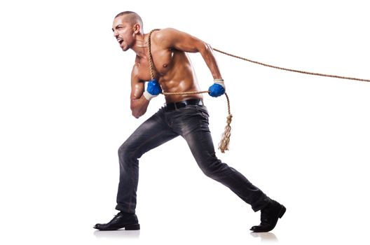 Muscular man pulling the rope