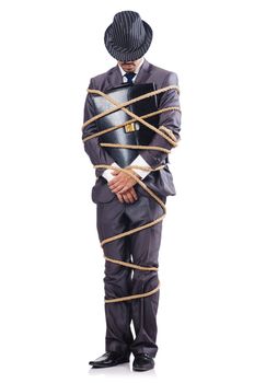 Businessman tied up with rope