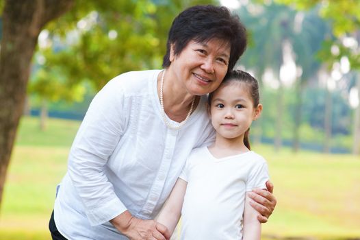 Asian grandmother and grandchild at outdoor