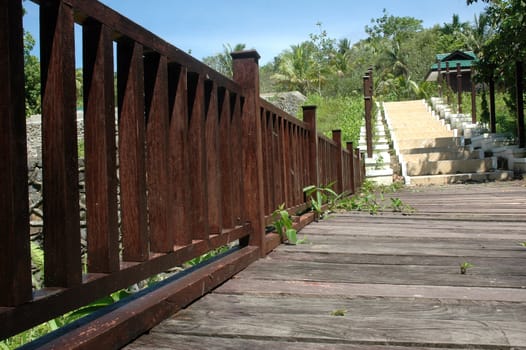 wooden bridge and concrete stairs in a park