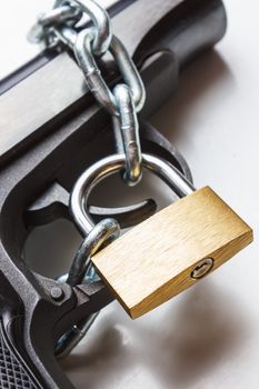 the gun coiled chain closed by a padlock