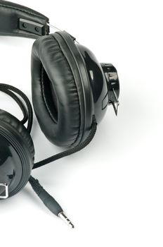 Black Headphones with Cord closeup on white background
