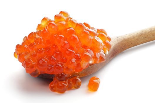 Perfect Red Caviar in Wooden Spoon closeup on white background