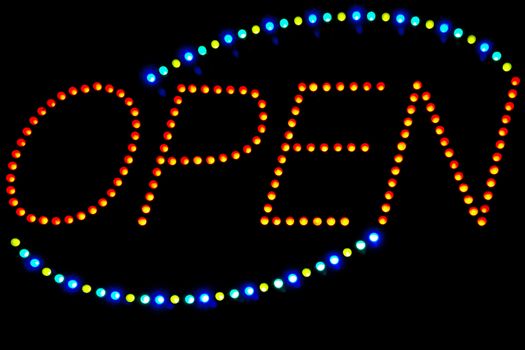 Glowing LED Open sign on a black background