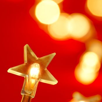 Star shaped Christmas light with blured background, very shallow DOF
